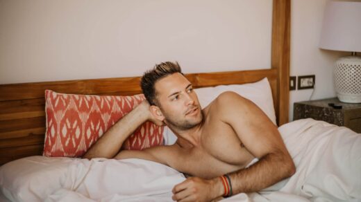shirtless-sexy-male-model-lying-alone-on-his-bed-i-K5ZT3Y7-scaled-1