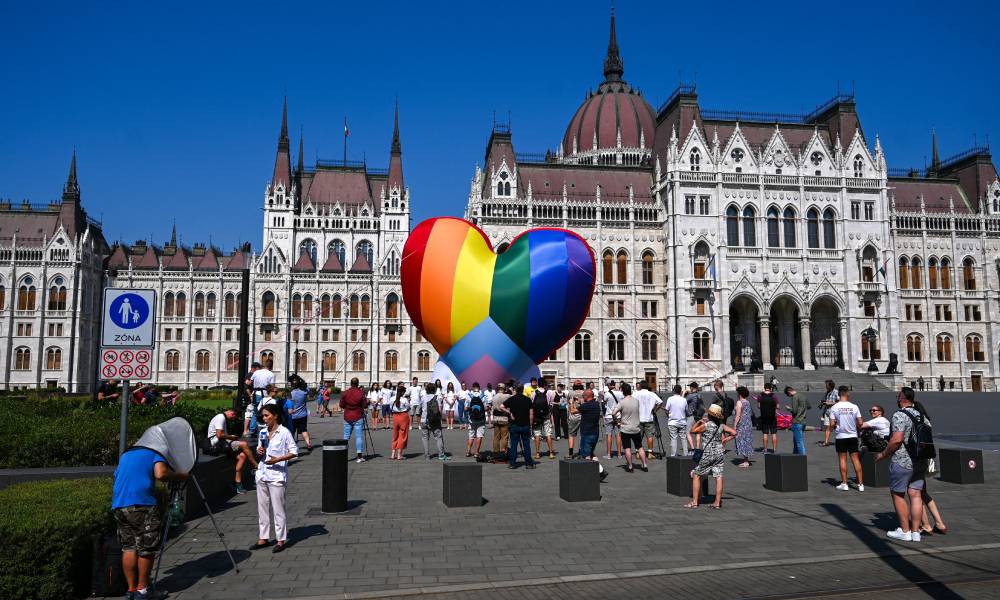 Activists rainbow heart balloon anti-LGBT Hungary