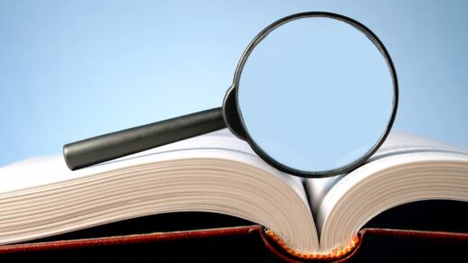 book-and-a-magnifying-glass-on-a-blue-background-2021-08-26-20-11-09-utc