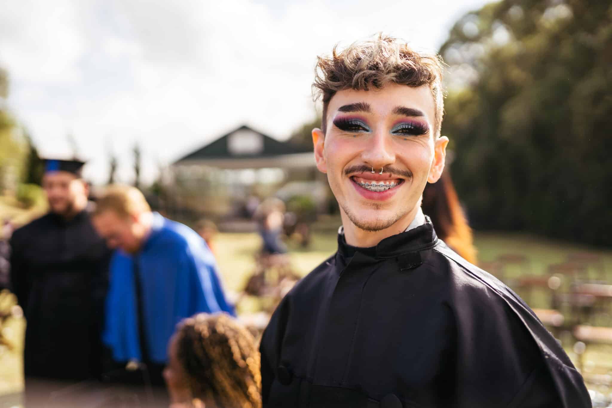 A nonbinary student during a graduation event.