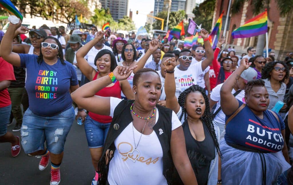 Members of the South African Lesbian, Gay, Bisexual and Transgender and Intersex (LGBTI) community chant slogans as they take part in the annual Gay Pride Parade. 