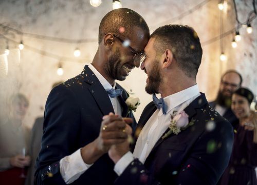 Two men dancing at a wedding
